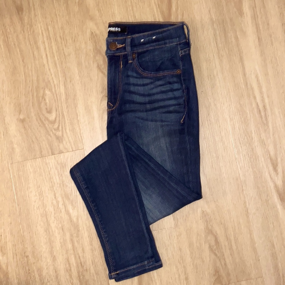 Size 4 mid rise stretch jean leggings from Express